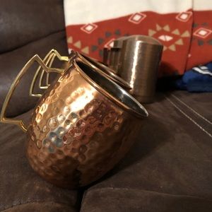 Copper hammered mugs with matching salt and pepper shakers.